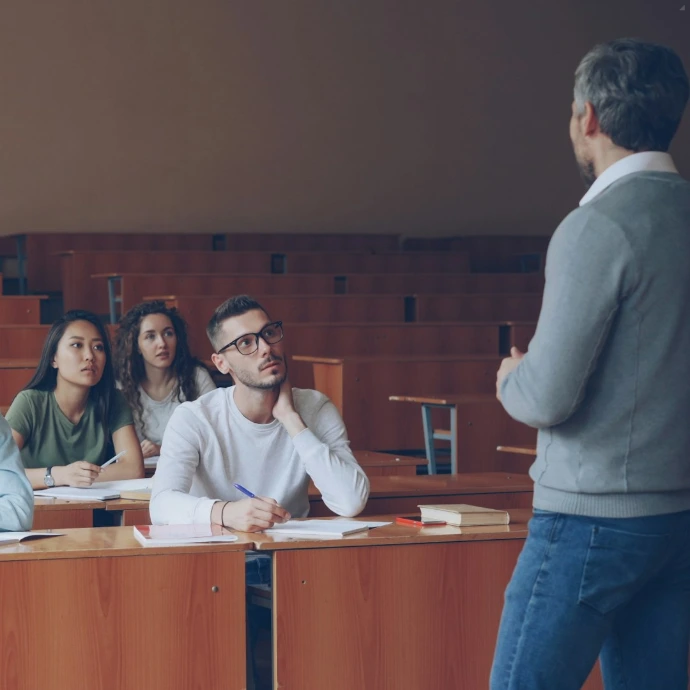 Professor teaching students in a lecture hall